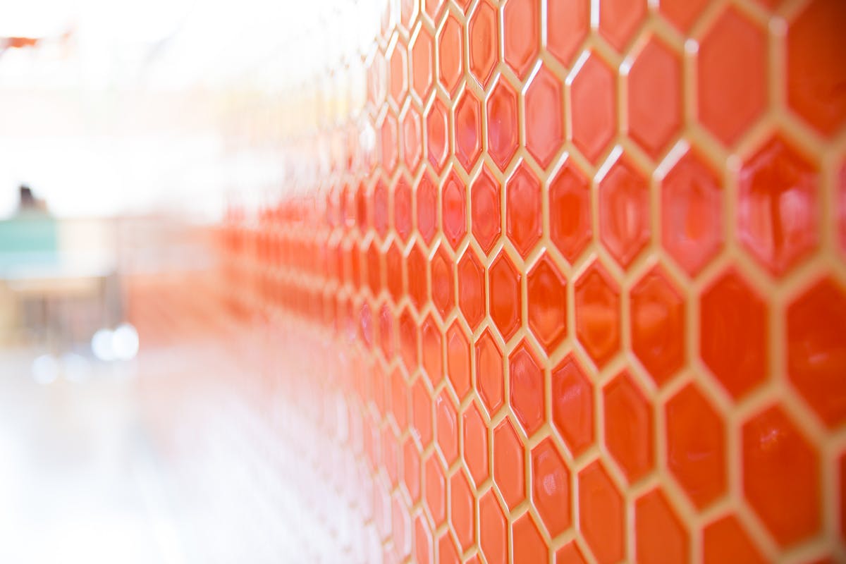 a close up of a honeycomb painted wall