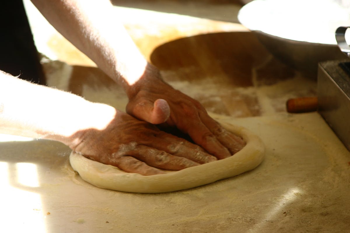 hands preparing a dough