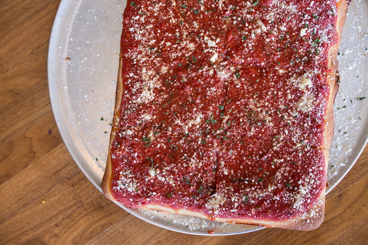 a close up of a pizza on a plate