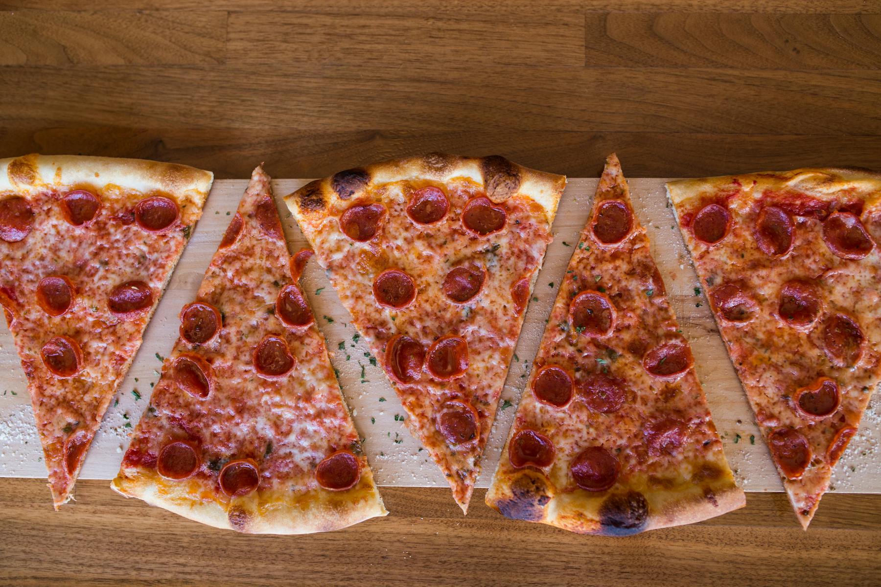 slices of pepperoni pizza on a table
