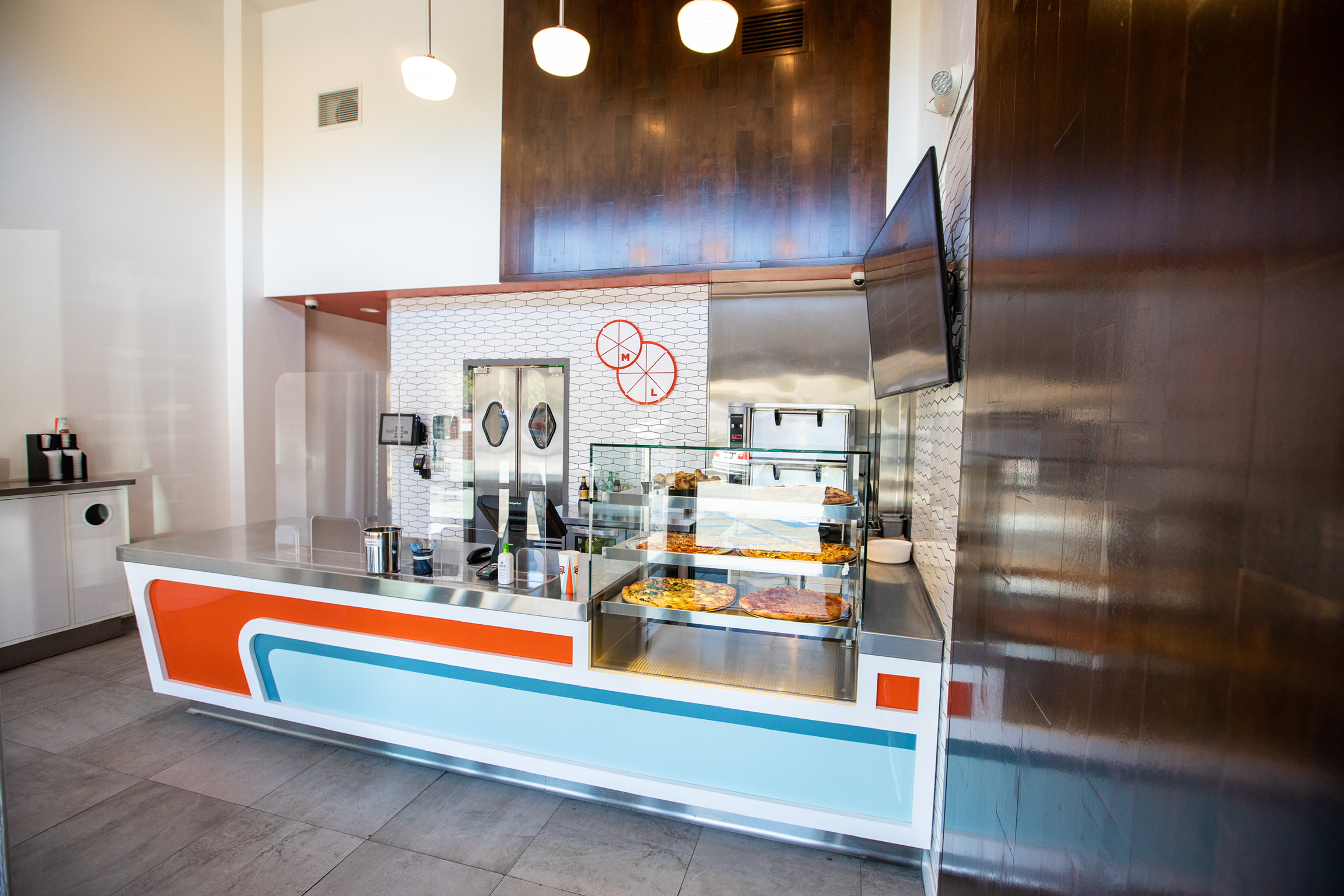 a kitchen with a sink and a refrigerator