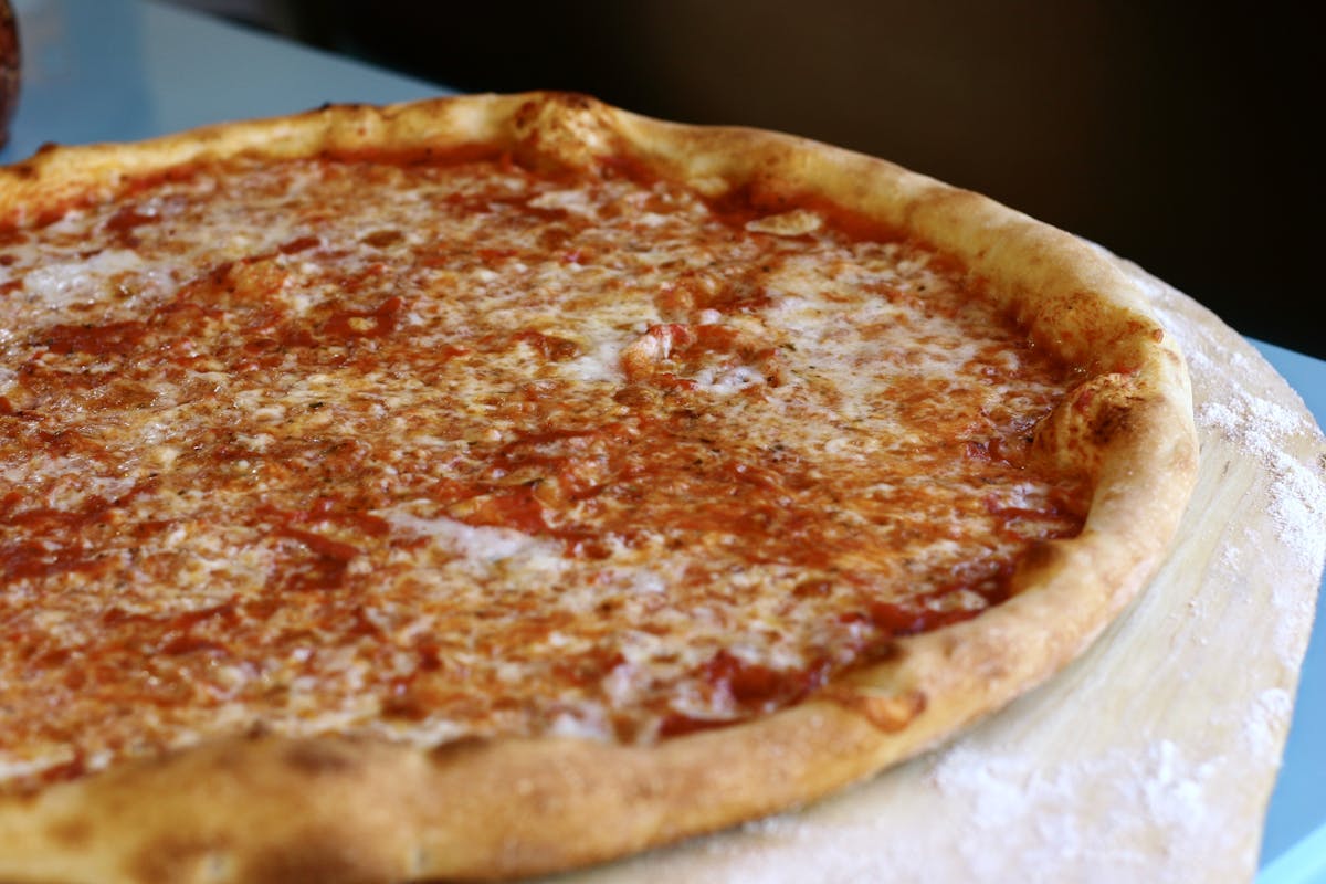 a pizza sitting on top of a table