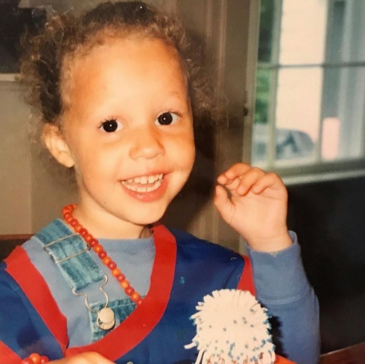 a small child smiling at the camera