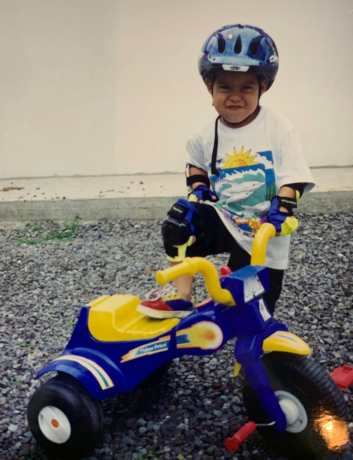a young boy riding a toy motorcycle