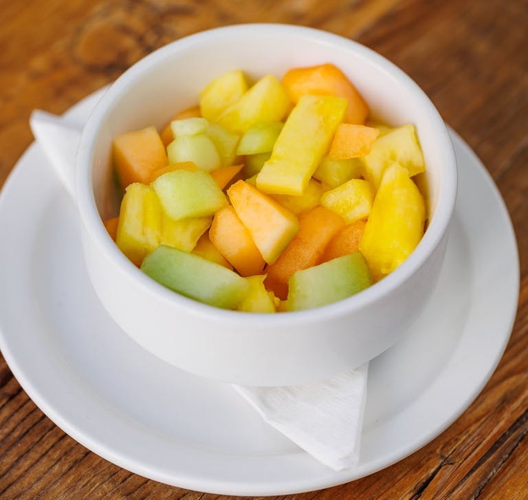 a bowl of fruit on a plate