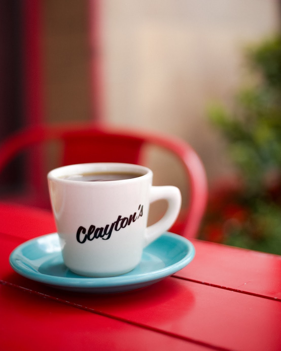 a close up of a coffee cup sitting on a table