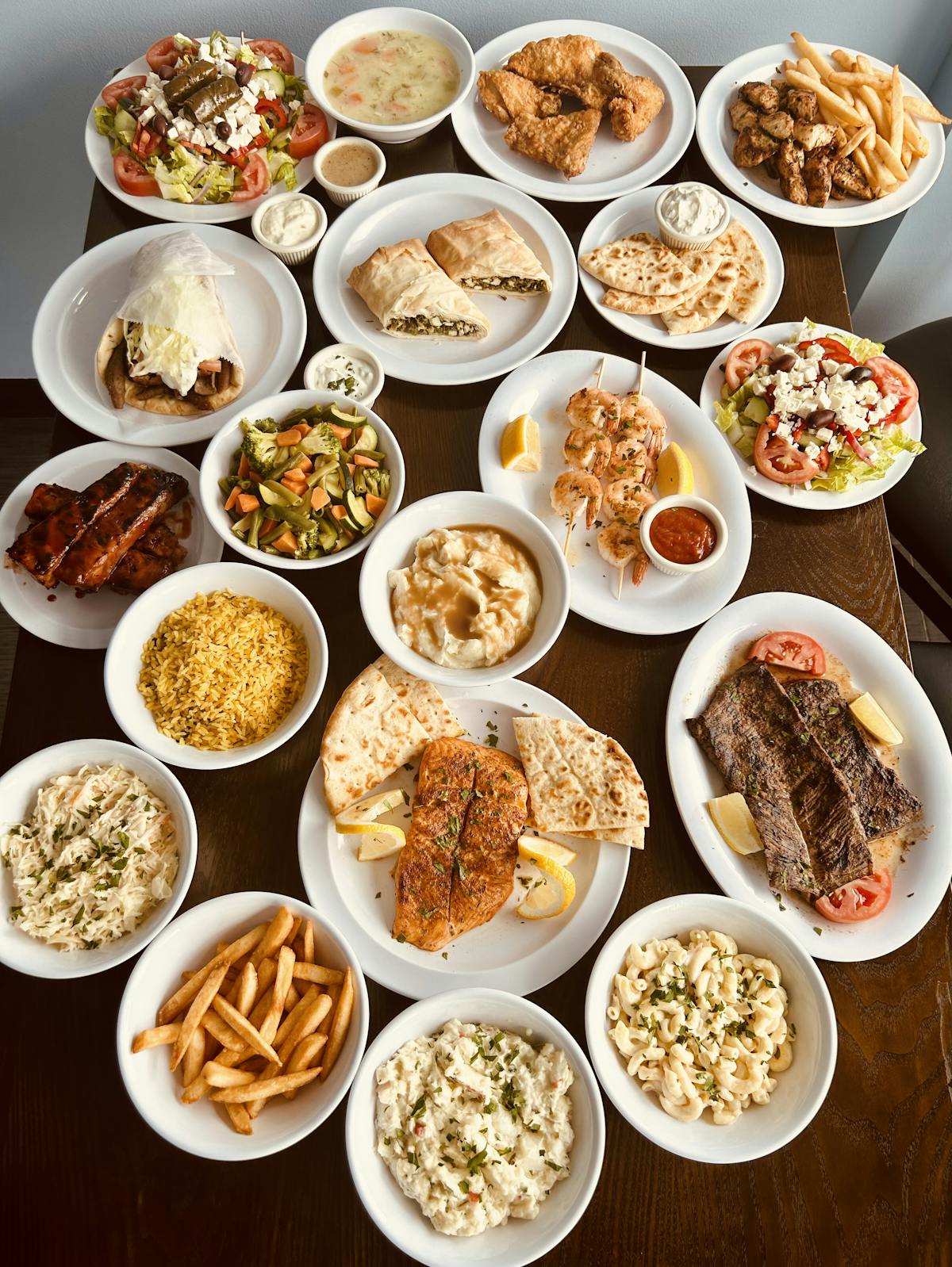 a dish is filled with many different types of food on a table
