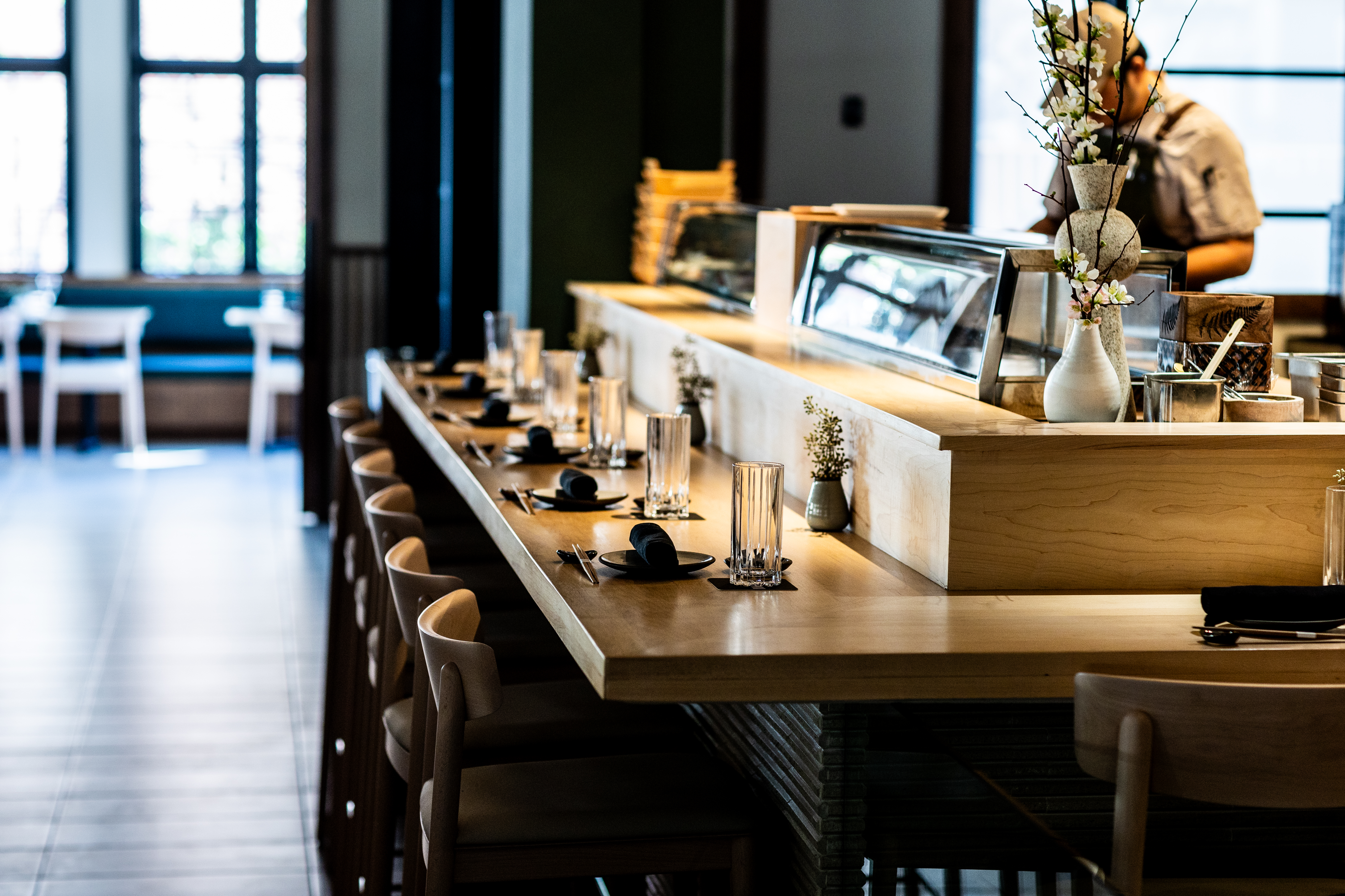 a dining room table in front of a window