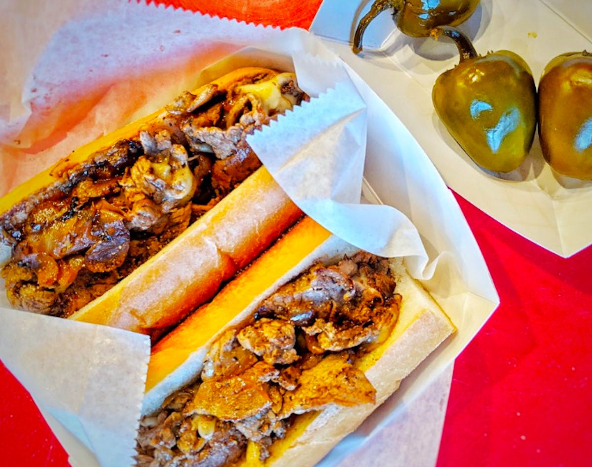 a sandwich sitting on top of a paper tray
