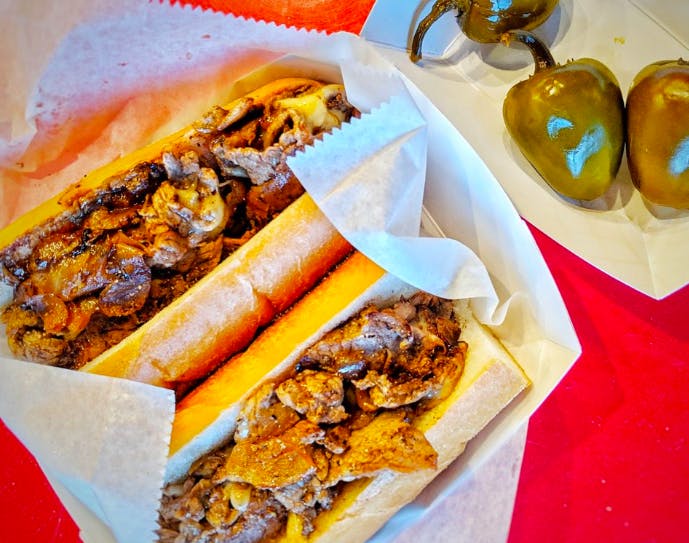 a sandwich sitting on top of a paper tray