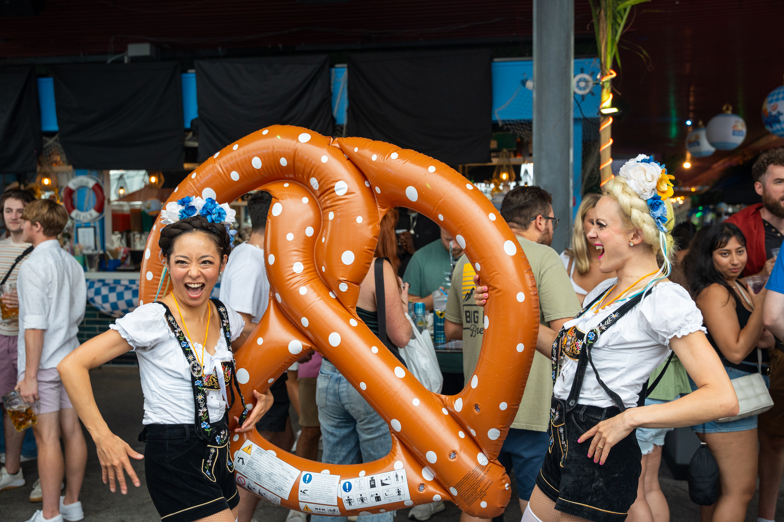 Lederhosen models with pretzel at OktoberFest NYC