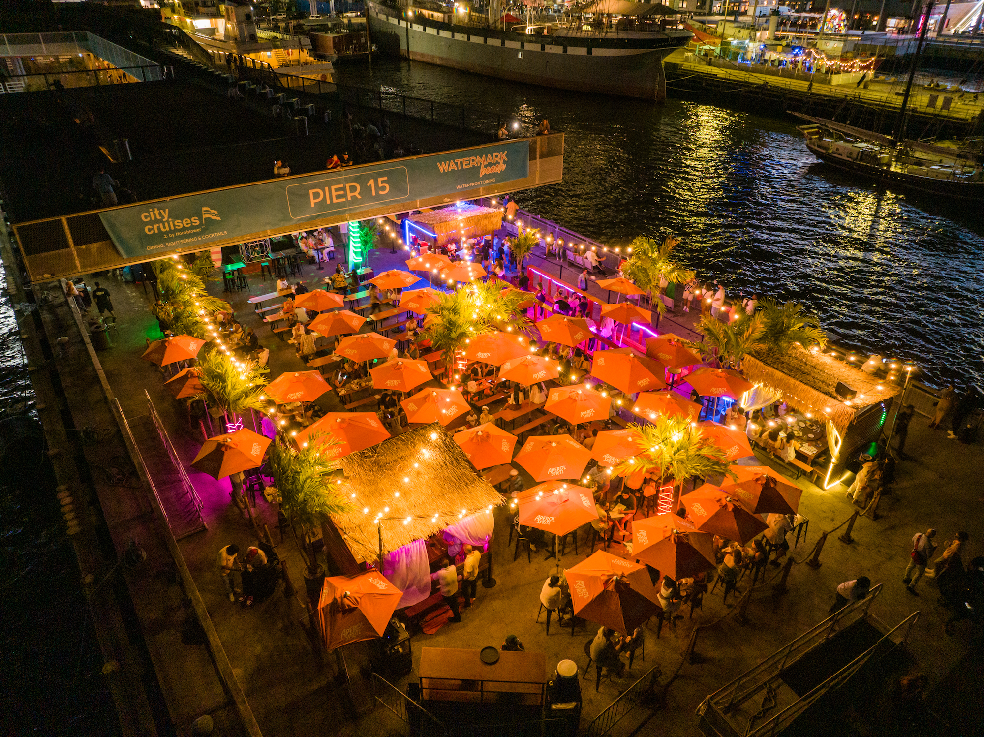 Watermark Beach waterfront celebration with colorful summer drinks.