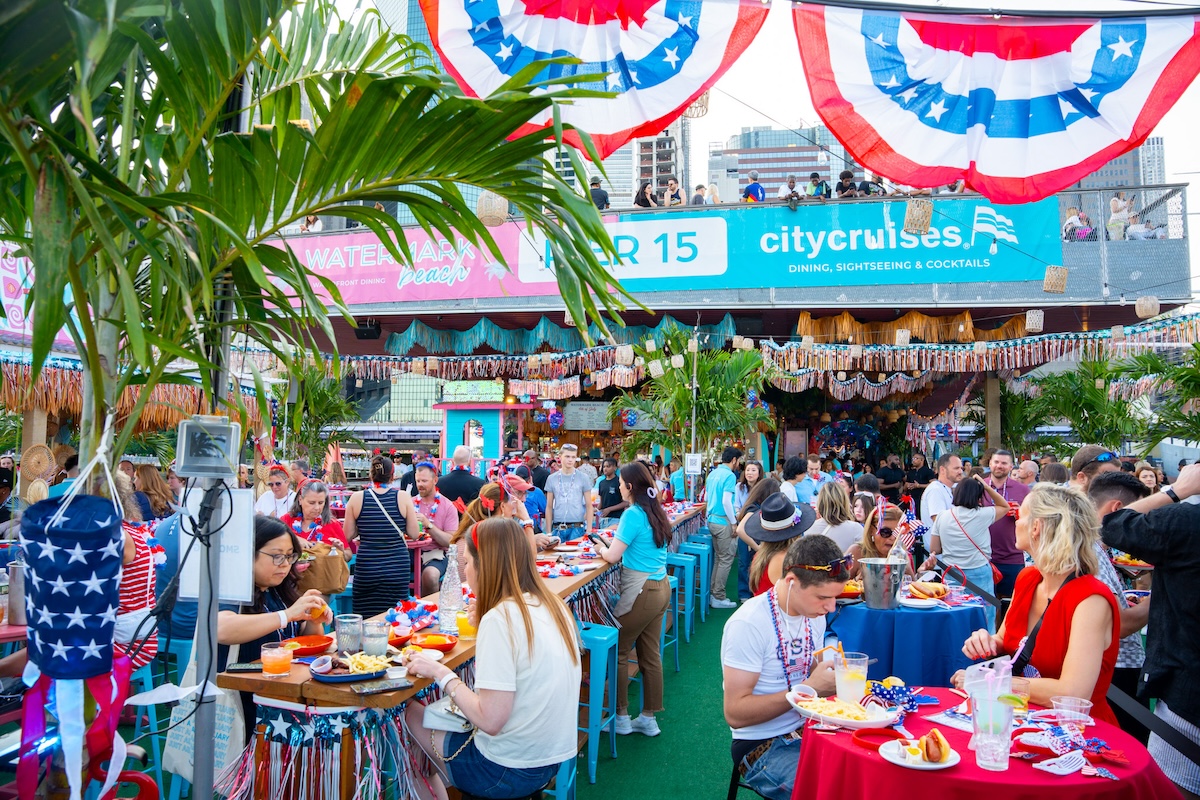 Guests enjoying fireworks and cocktails at Watermark Pier 15