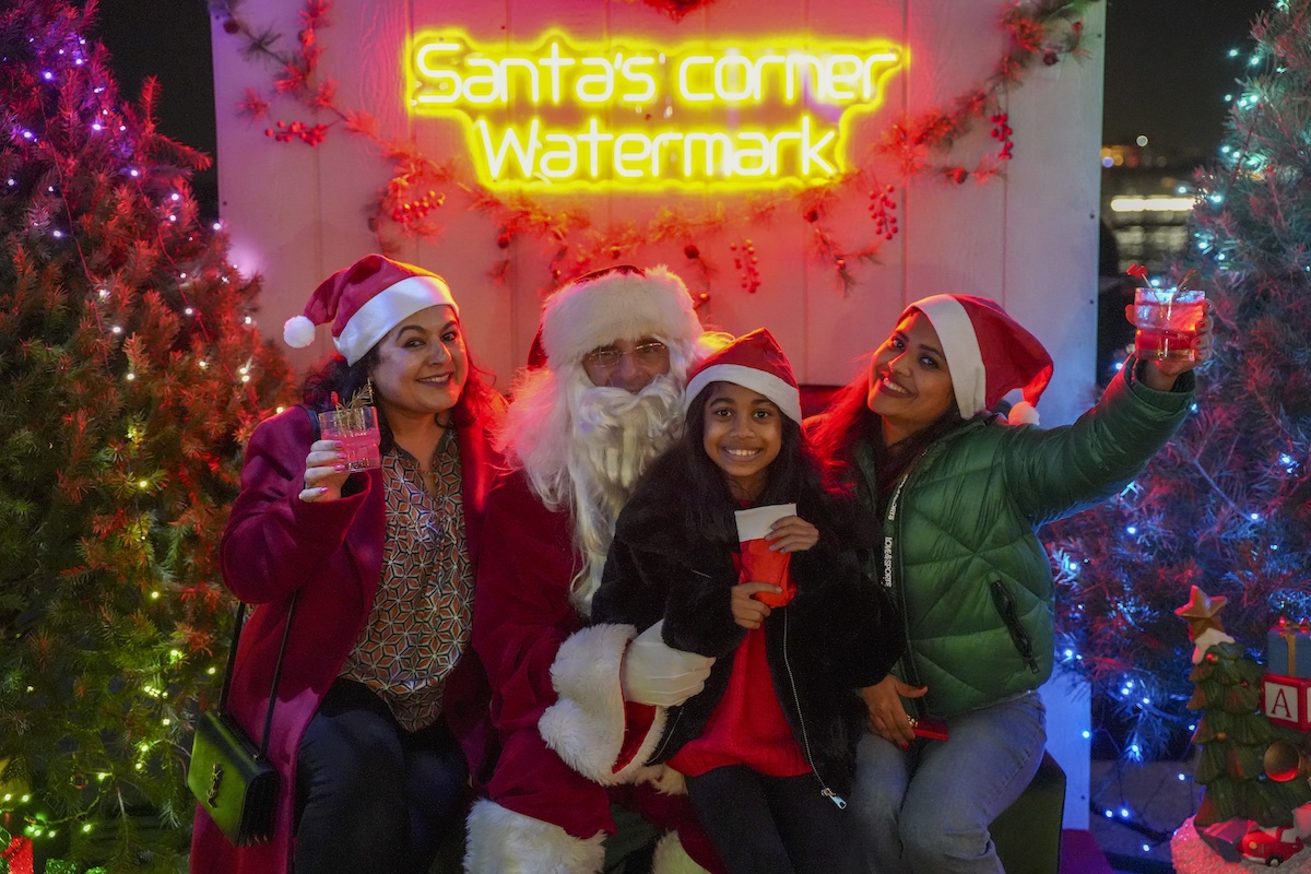 Guests celebrating at Winter Wonderland with city lights