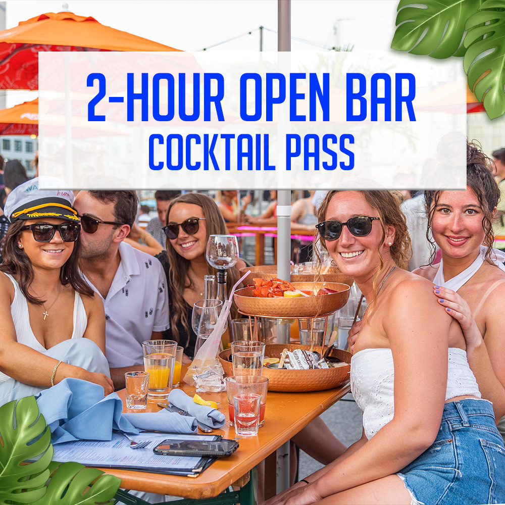 Guests holding cocktails with views of the waterfront