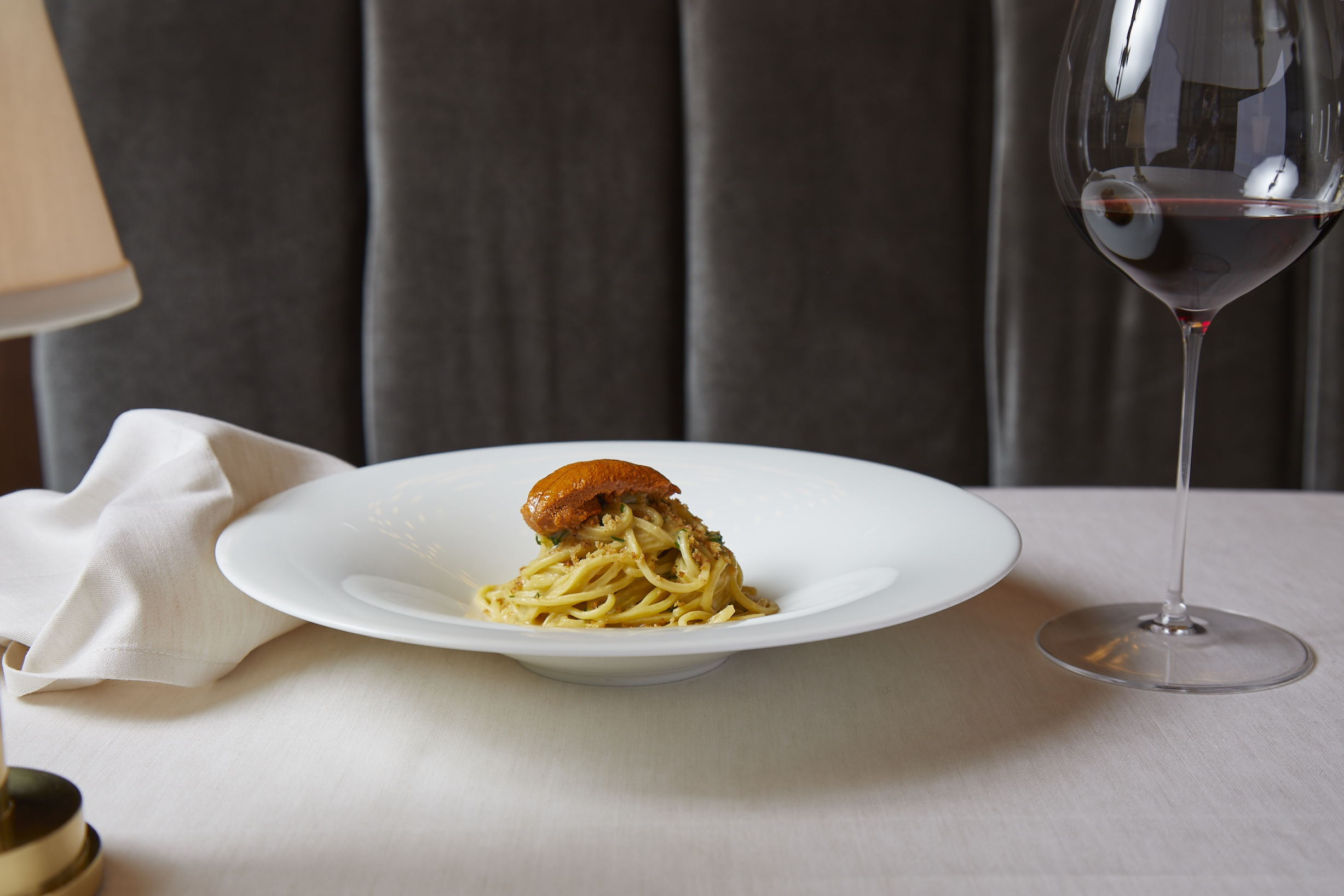 a plate of food and a glass of wine