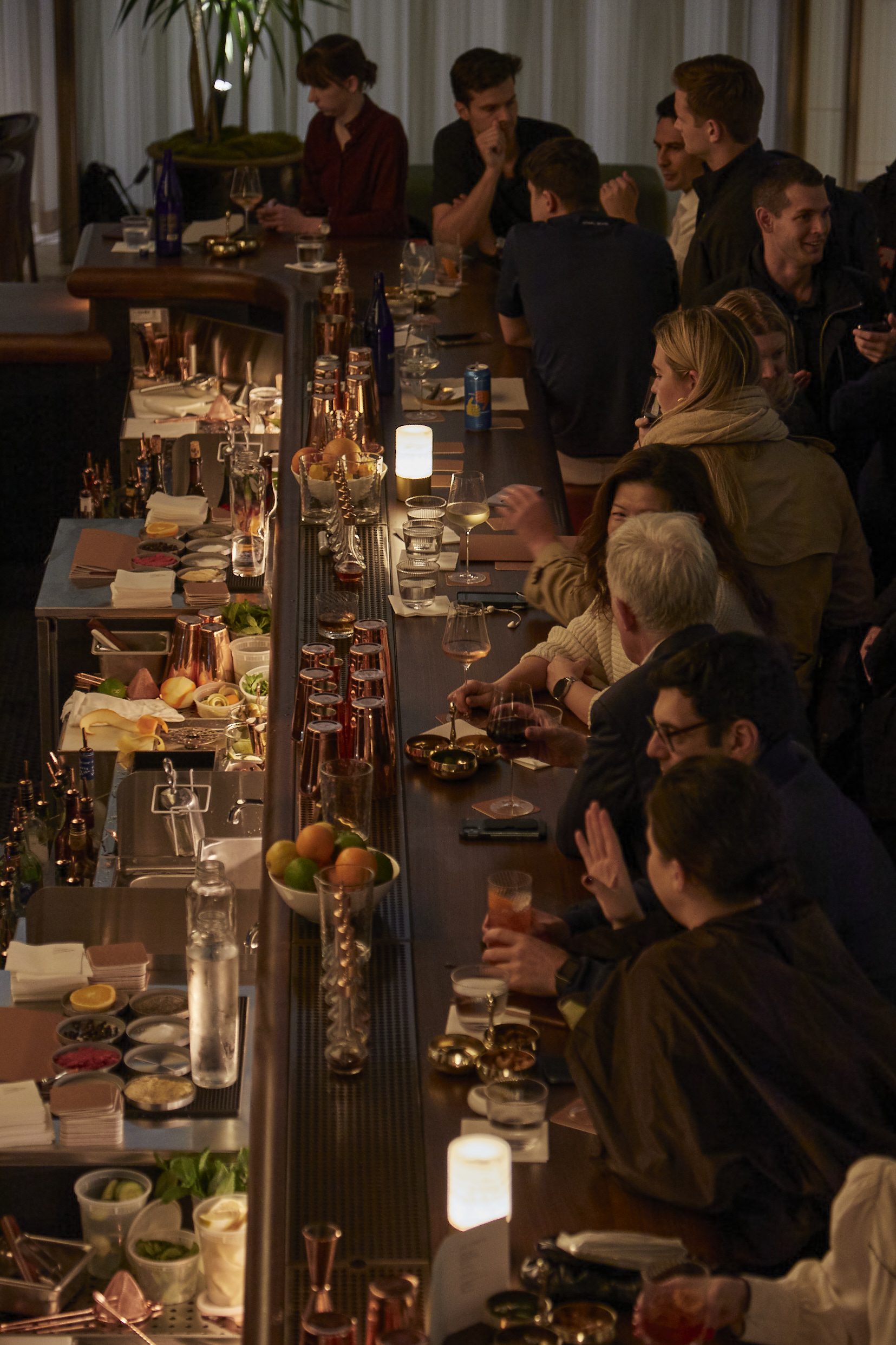 a group of people sitting at a table in a restaurant