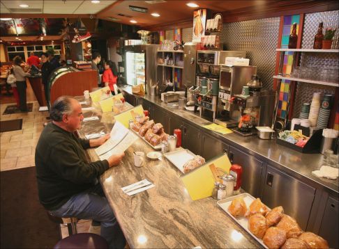 a man preparing food in a kitchen
