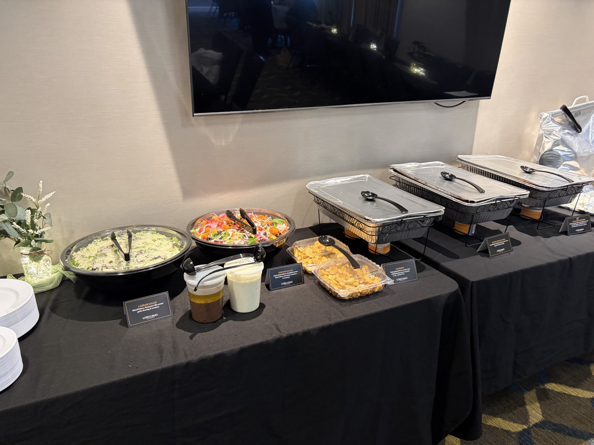 food on a table with a tv