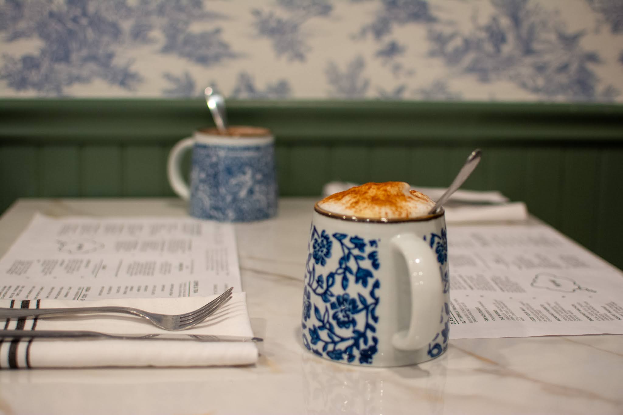 a cup of coffee on a table