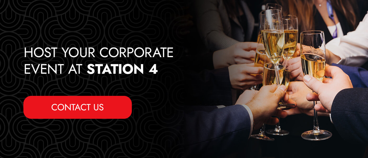 a group of people holding drinks