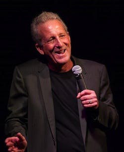 Bobby Slayton wearing a suit and tie