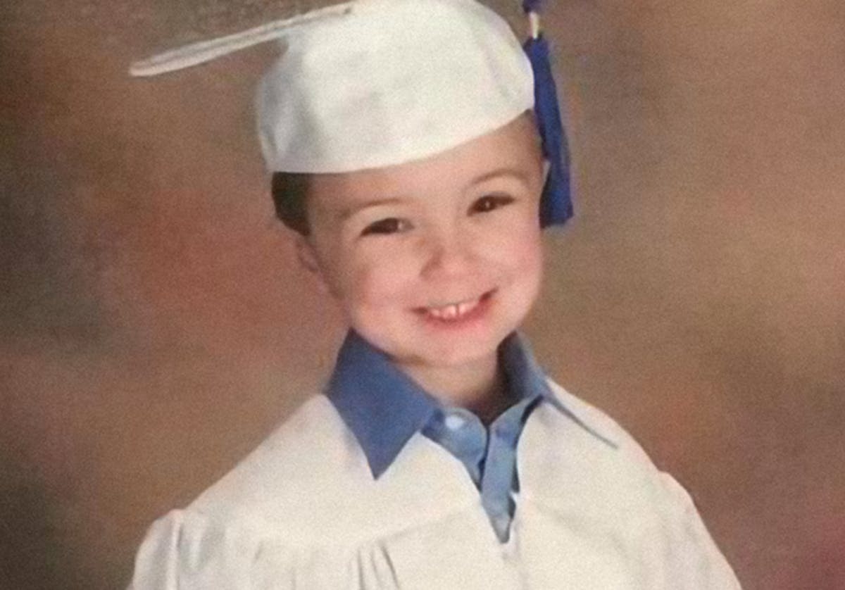 a young boy wearing a hat