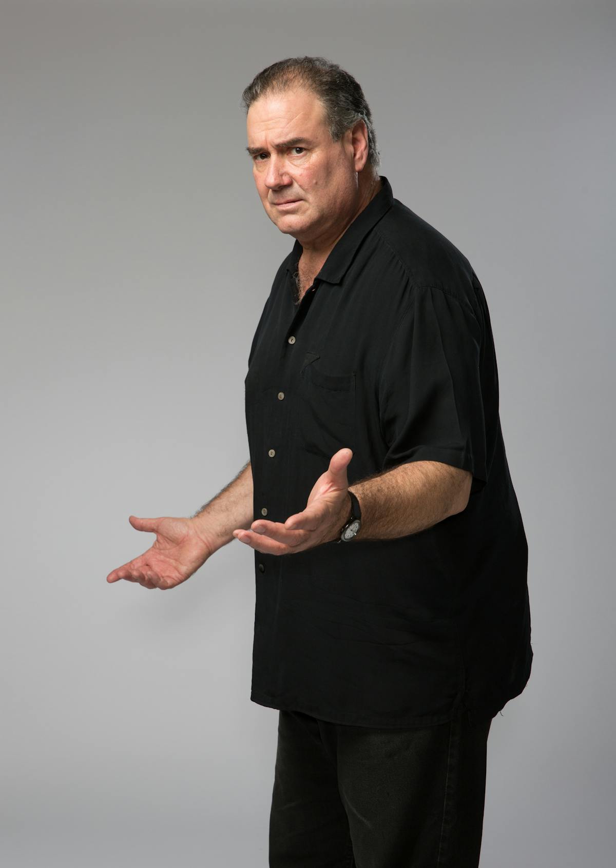 a man holding his hand up