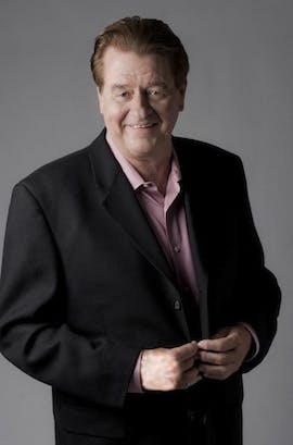 Don Gavin wearing a suit and tie