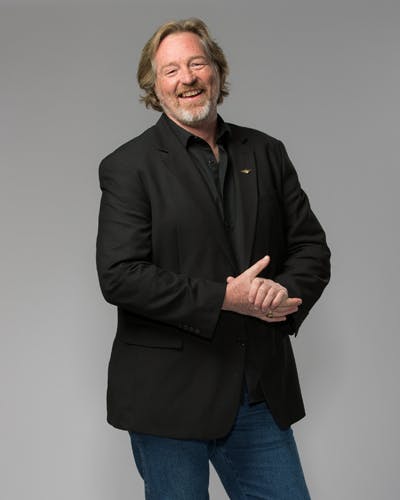 a person standing posing for the camera