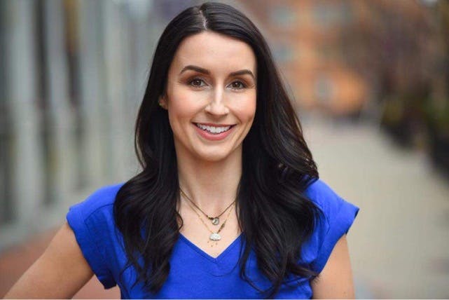 a woman in a blue shirt
