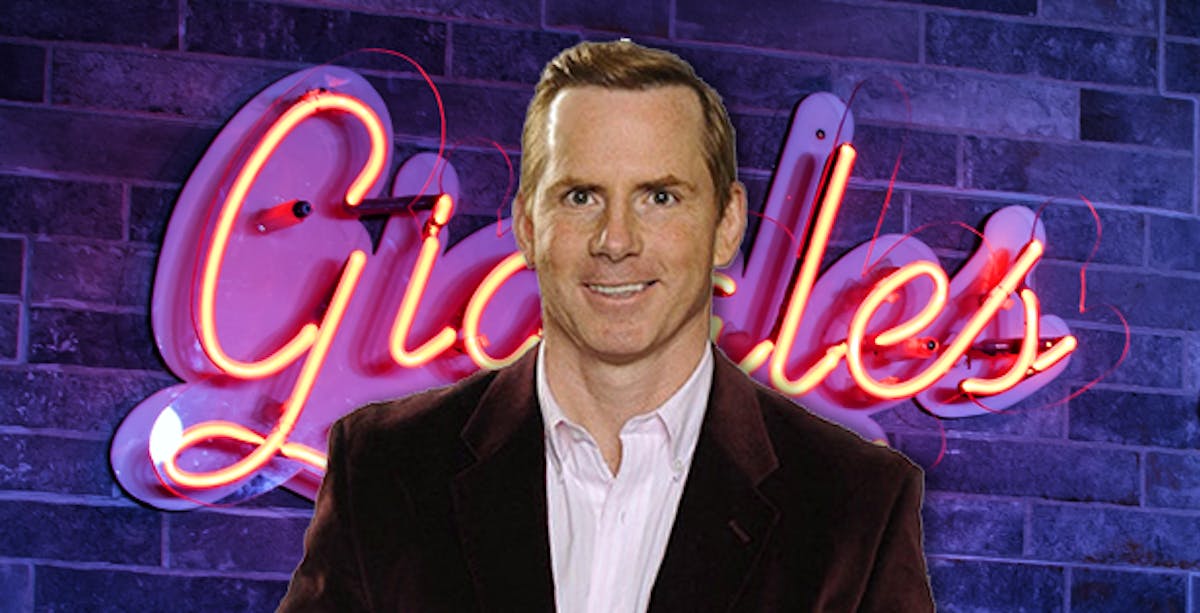 Tom Cotter standing in front of a building