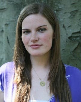 a woman wearing a purple shirt