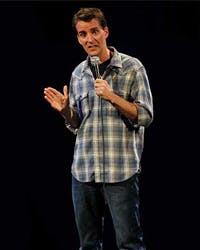 a man that is standing in the dark