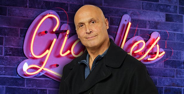 Brad Mastrangelo standing in front of a brick wall