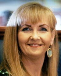 a woman smiling for the camera