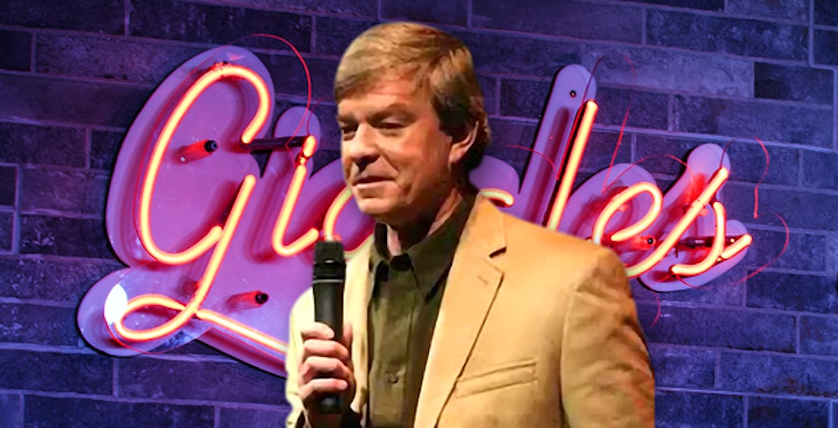 Mike Donovan holding a microphone