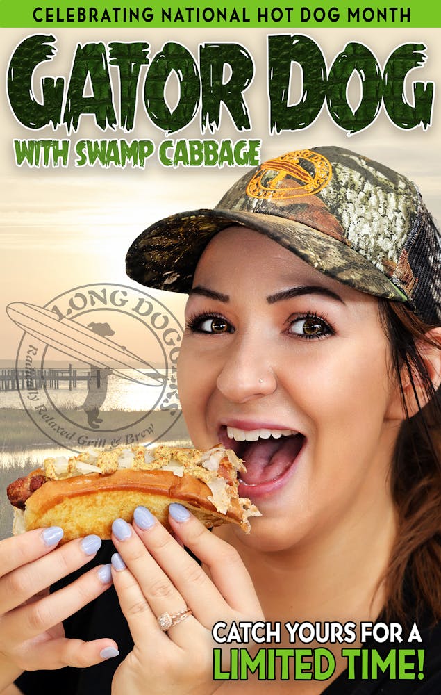 a woman eating a hot dog