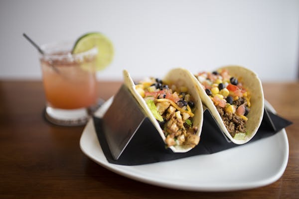 a plate topped with two tacos