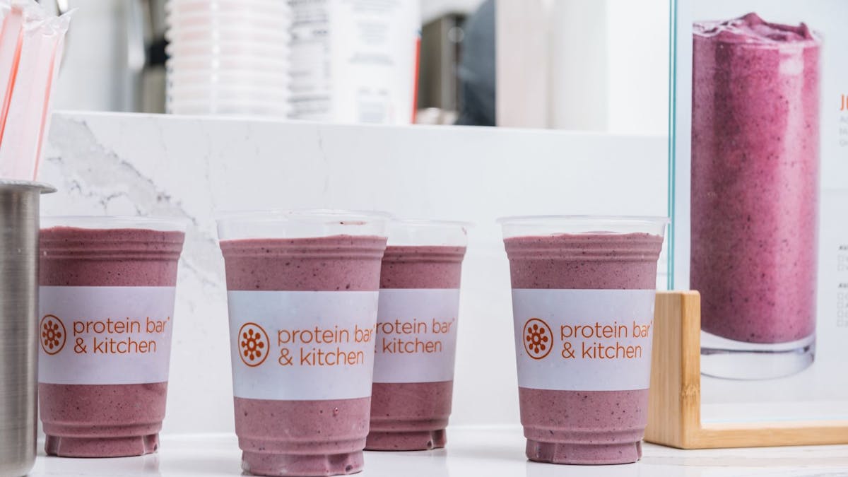 three cups with smoothie