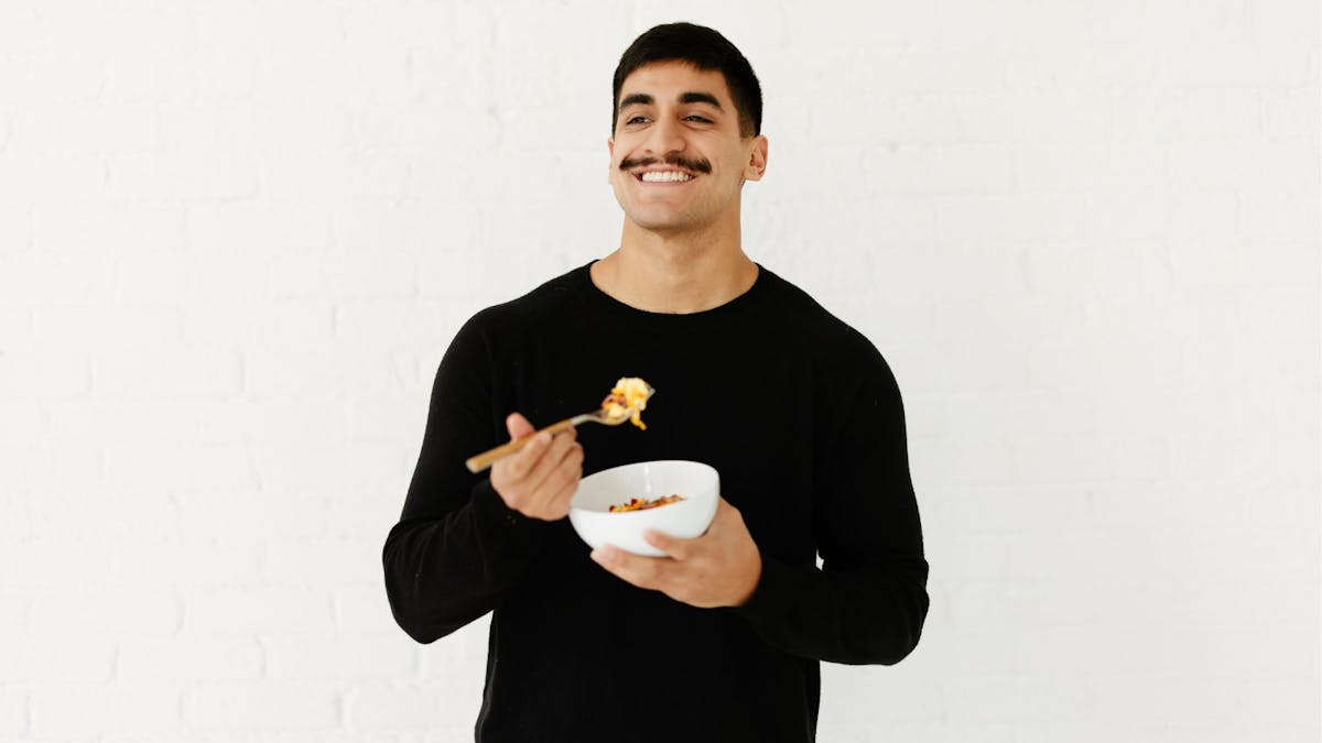 a man eating a bowl