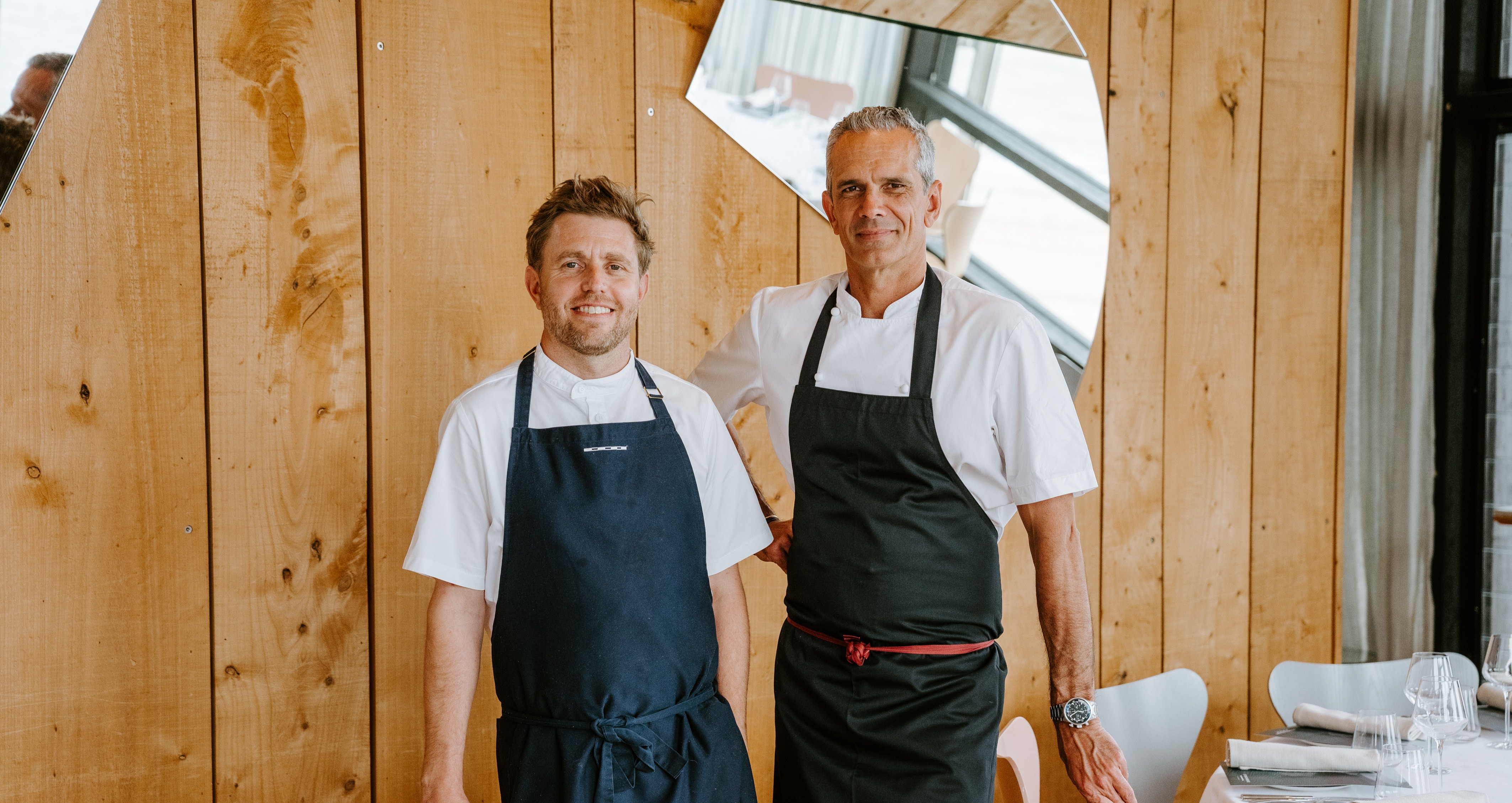 a man standing on top of a wooden door