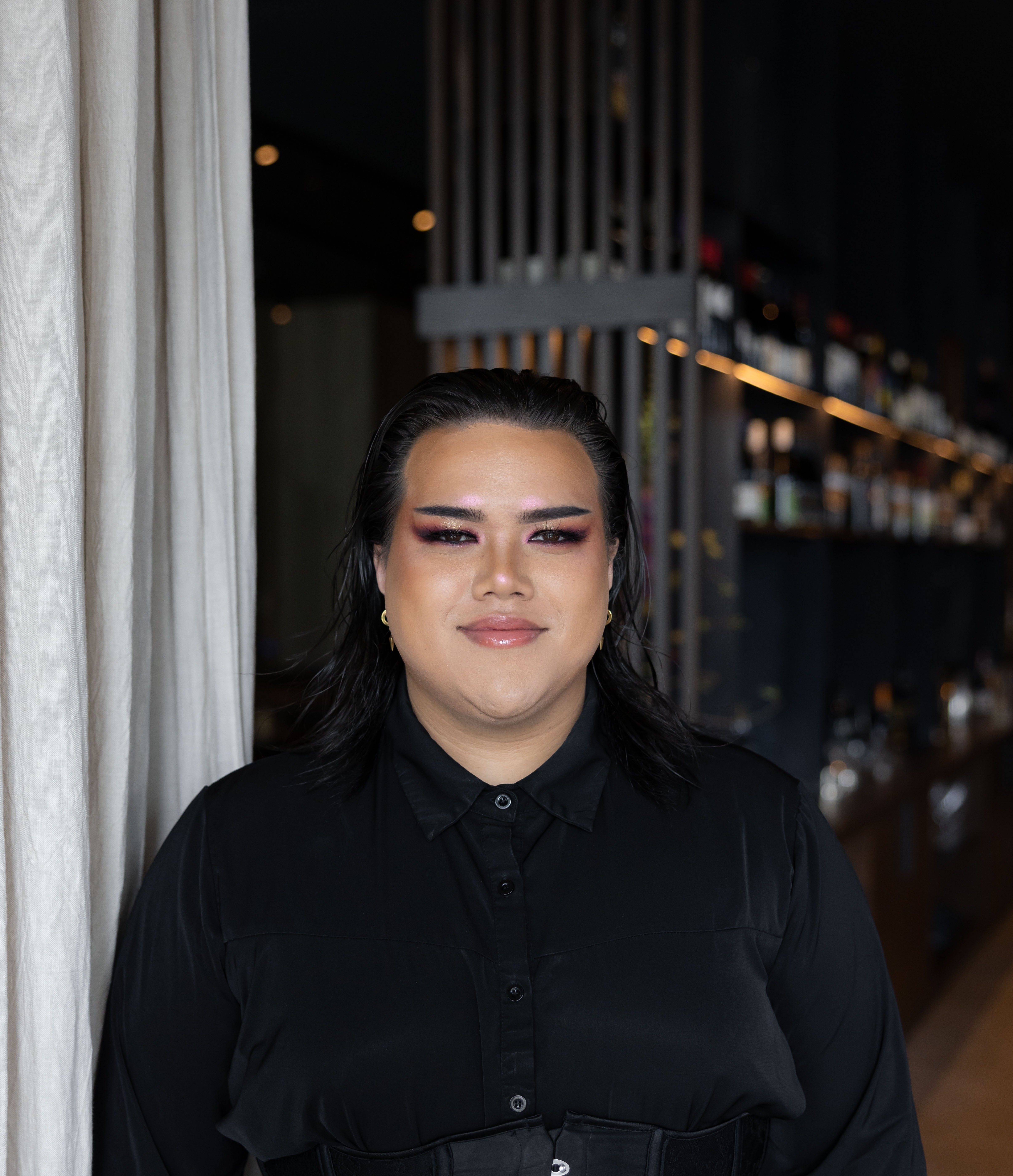 a person standing in front of a laptop