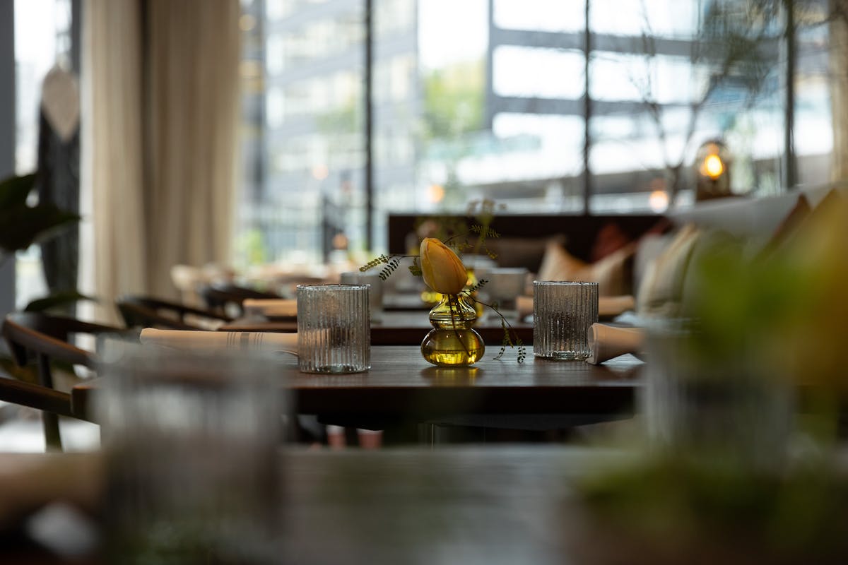 a dining room table in front of a window