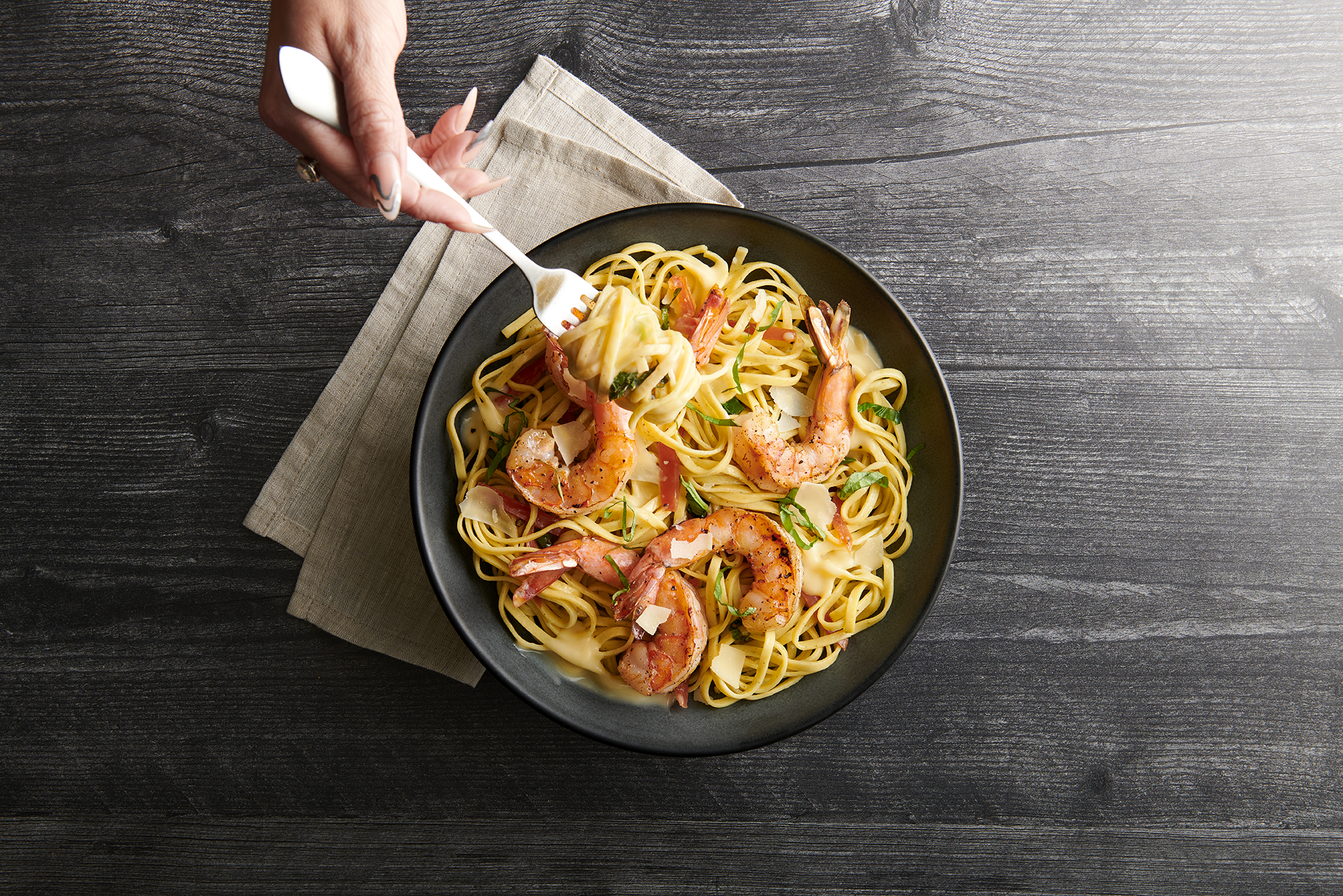 a person holding a bowl of food