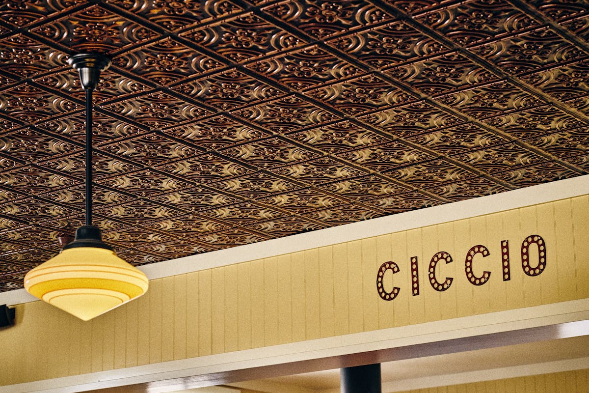 close up of ciccio sign above the kitchen pass