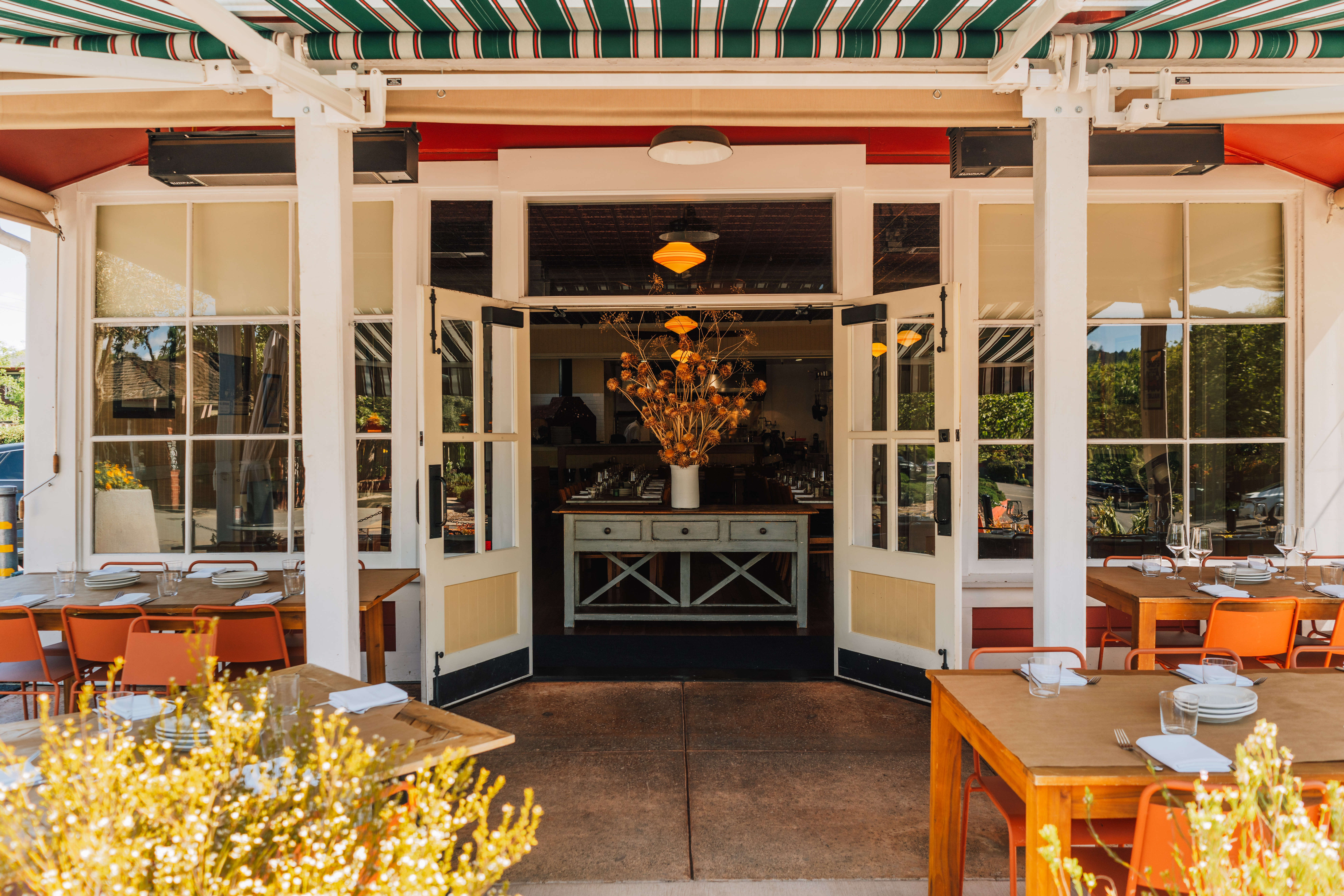 a restaurant with tables and chairs