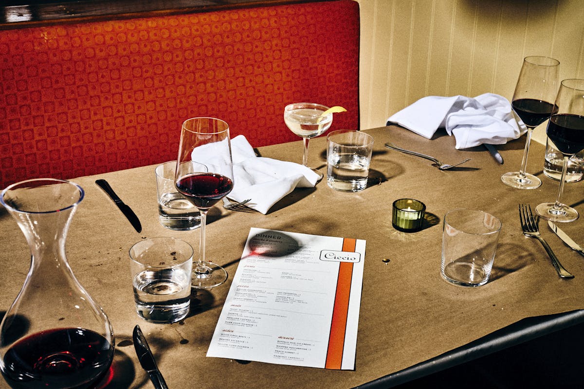table at ciccio with menu and wine glasses