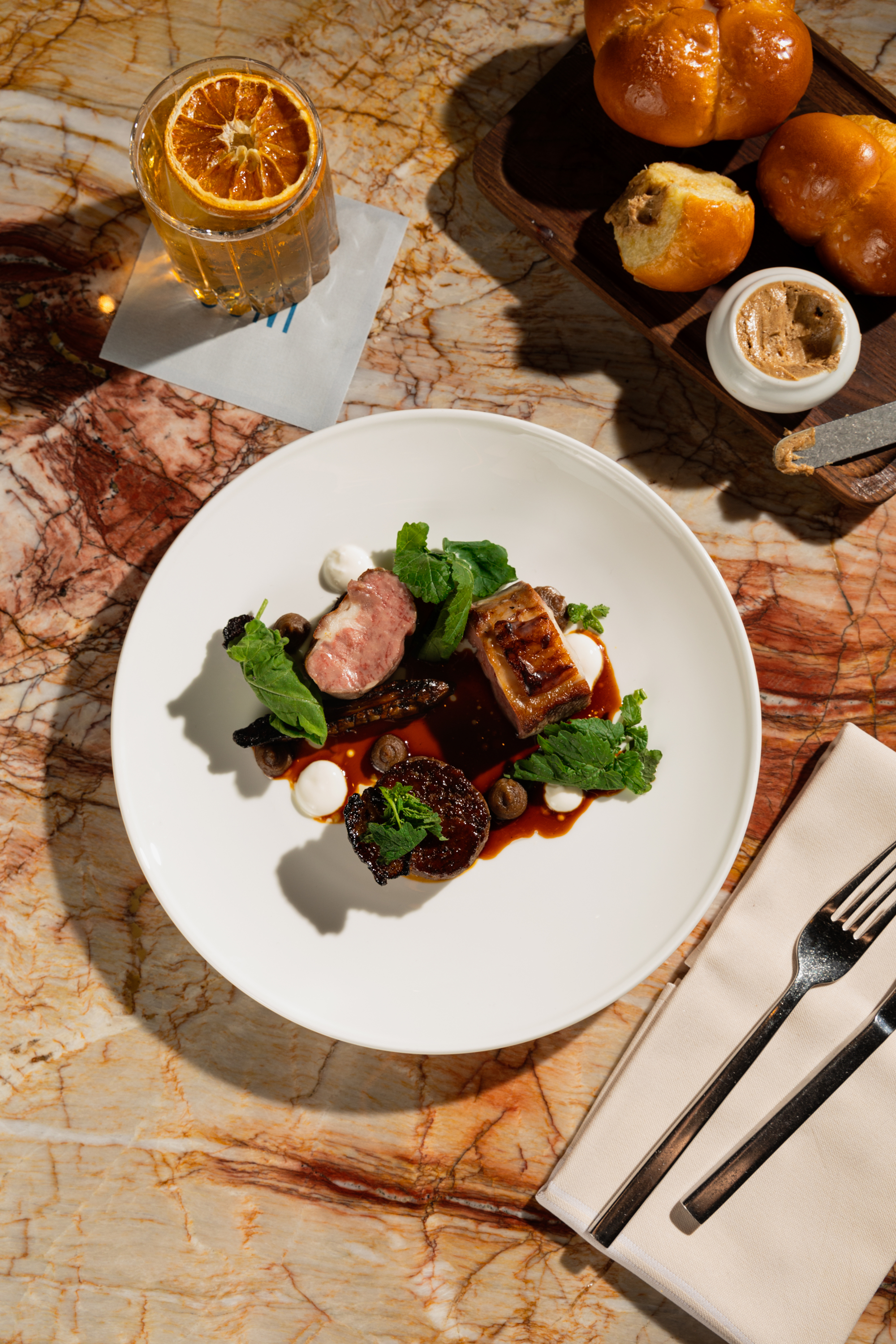  A beautifully arranged table featuring an array of food and drinks, inviting guests to enjoy a delightful meal