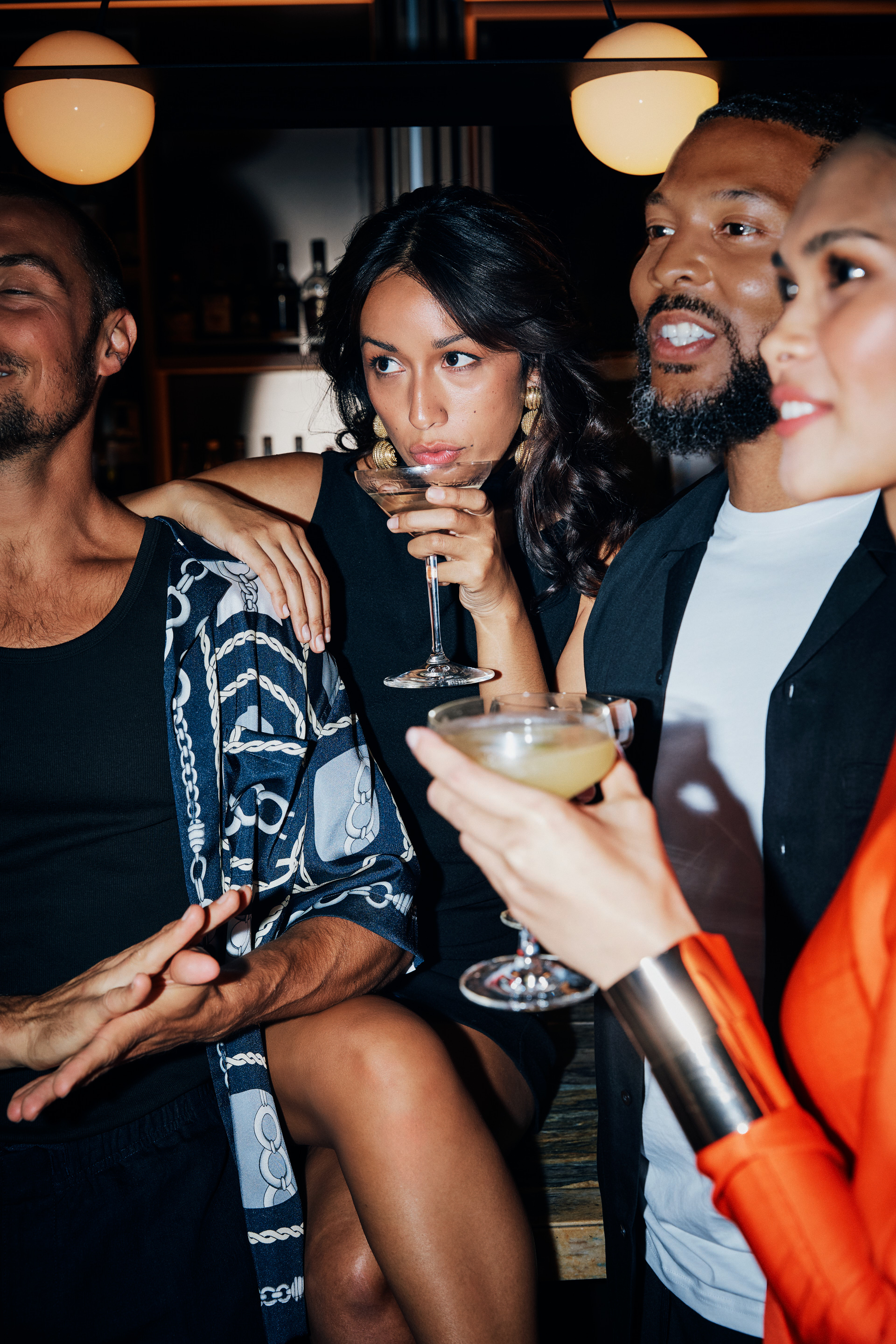 A lively group of friends enjoying themselves at a vibrant party, filled with laughter and celebration